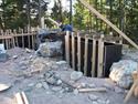 Construction of new concrete retaining walls incorporating native boulders.  