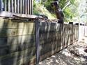 Wood bulkhead retaining wall with steel I-Beams built in Ross. 